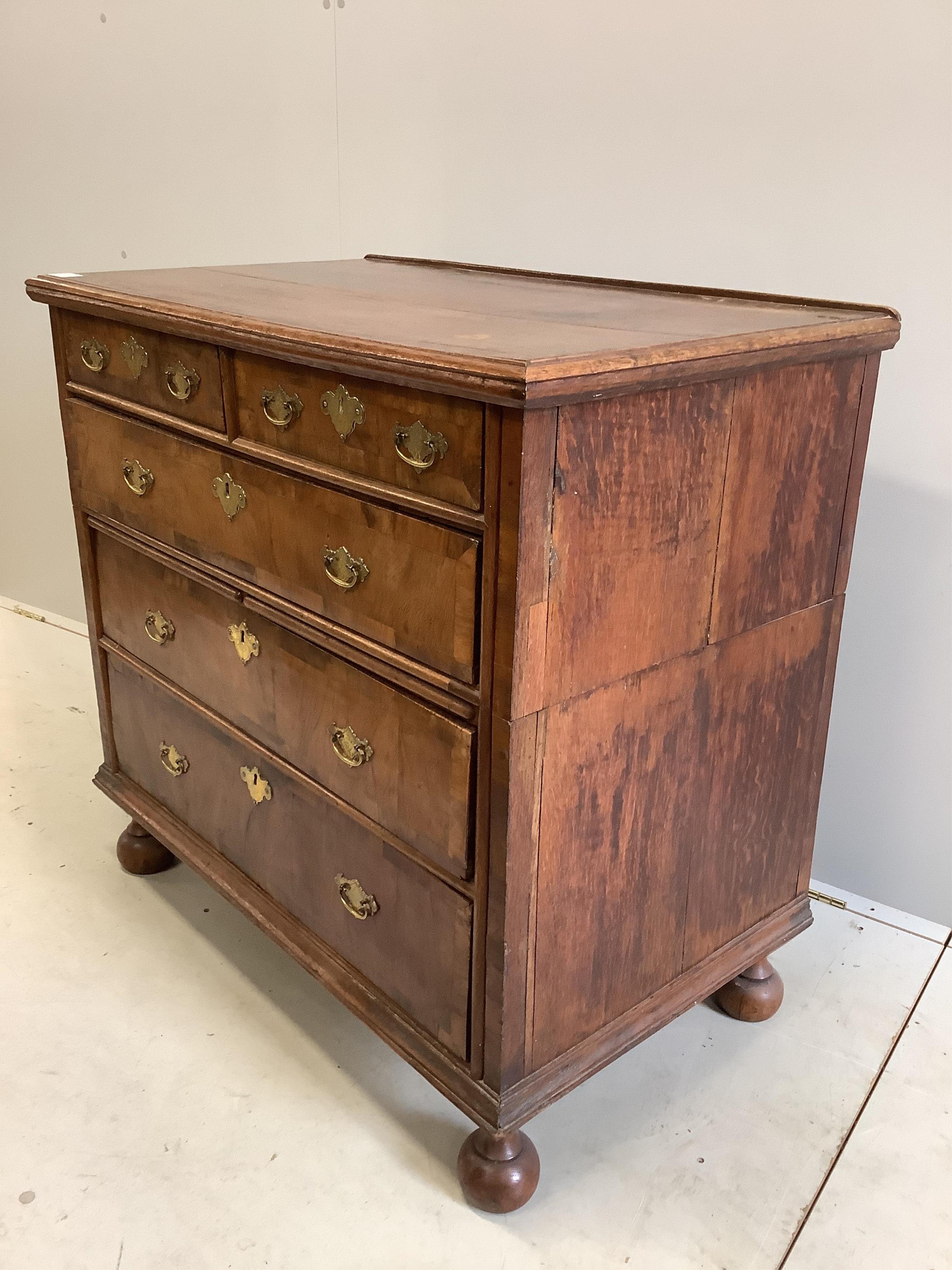 An early 18th century oak and walnut chest, in two sections, width 98cm, depth 58cm, height 93cm. Condition - fair